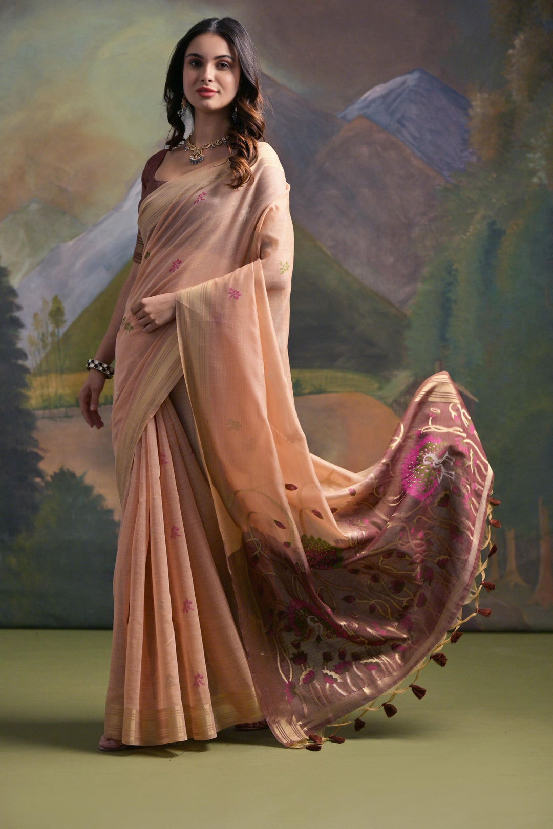 Soft peach Muga silk saree with intricate Resham detailing, perfect for elegant occasions.