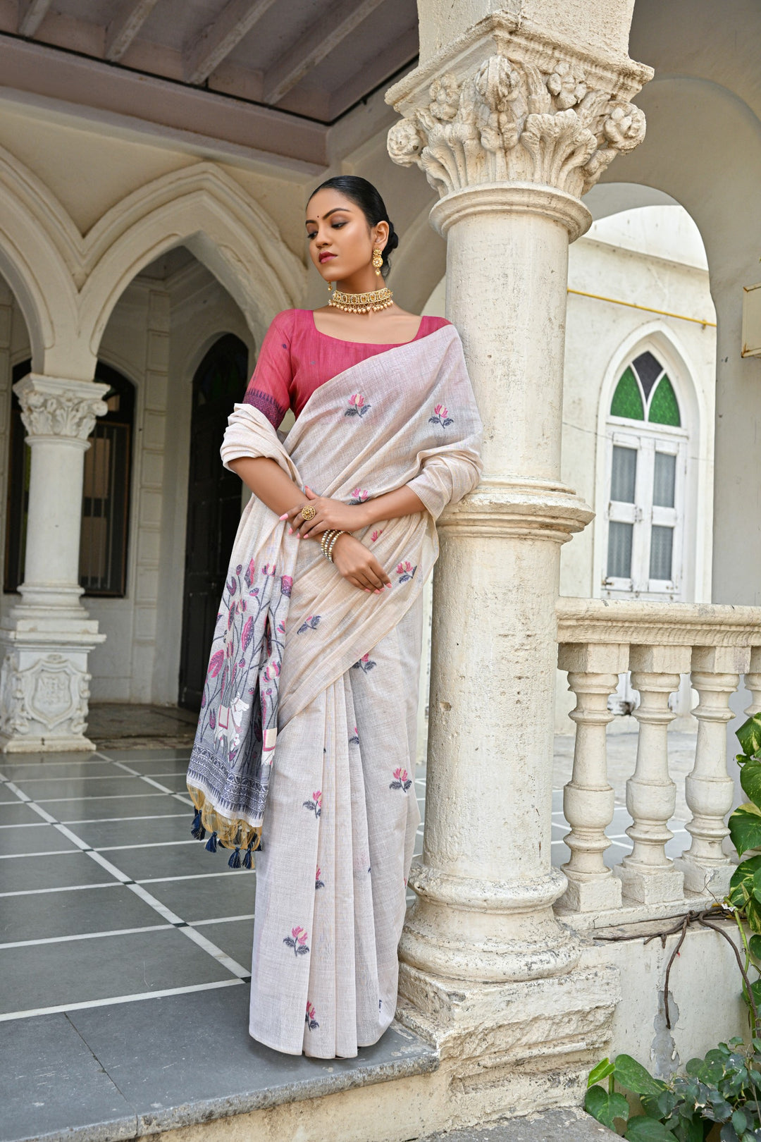 Elegant Muga silk saree with all-over floral pattern and tassels