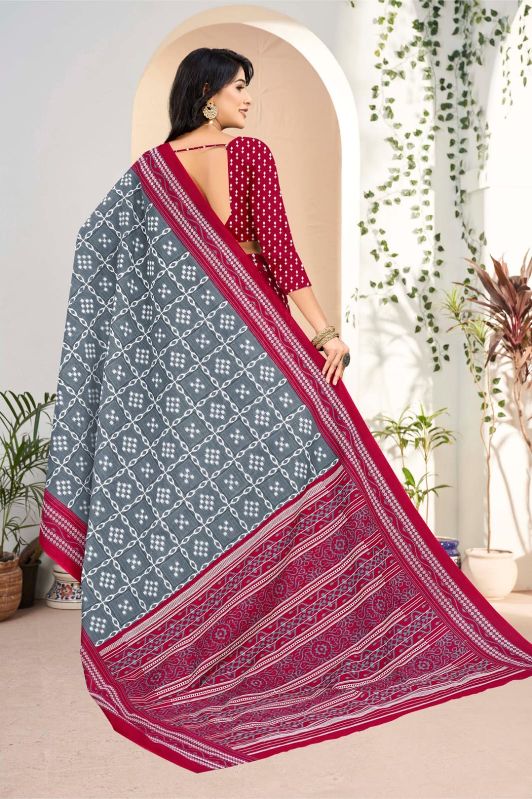 Handloom cotton saree in gray and burgundy with intricate tribal patterns, ideal for festive occasions.