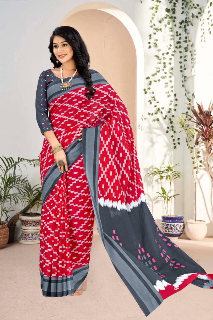 Elegant grey and red handloom cotton saree with tribal patterns, ideal for weddings and traditional celebrations.