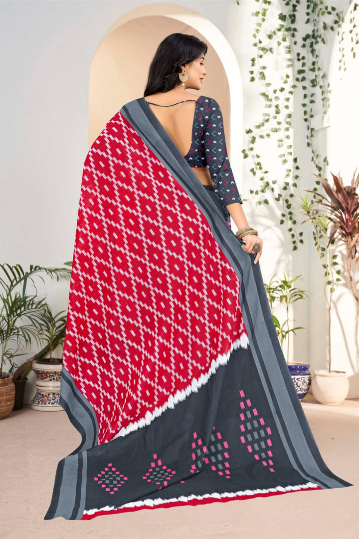 Stunning grey and red cotton saree with traditional tribal designs, perfect for cultural and wedding celebrations.