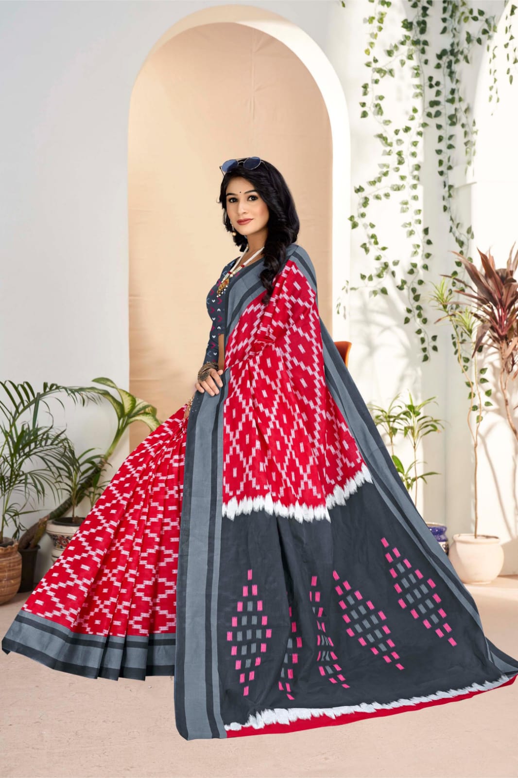 Stylish grey and red traditional saree featuring handloom craftsmanship and tribal designs, ideal for festive wear.