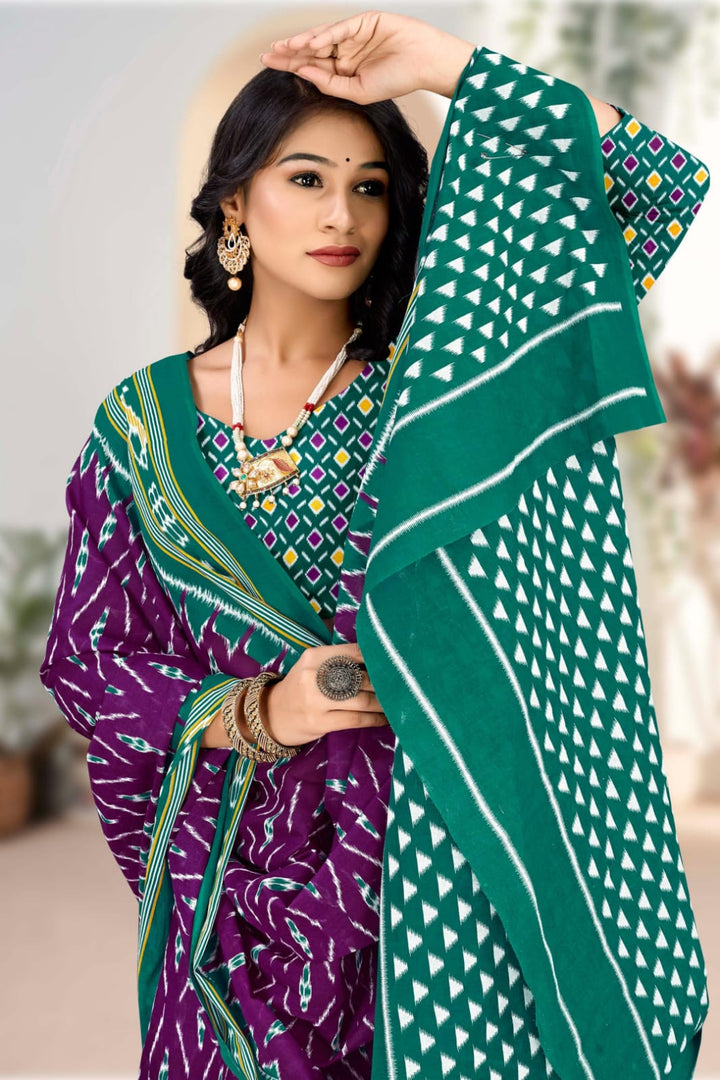 Stylish purple and pine green saree with tribal motifs, ideal for Indian cultural celebrations.