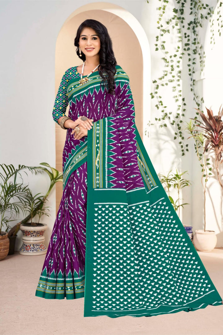 Purple and pine green designer saree with handloom cotton fabric and tribal prints, perfect for parties.