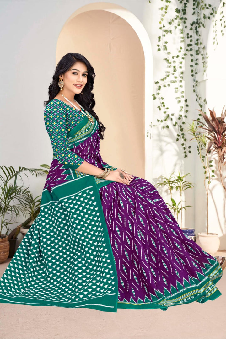 Beautiful purple and pine green designer saree with unique tribal motifs, ideal for cultural events.