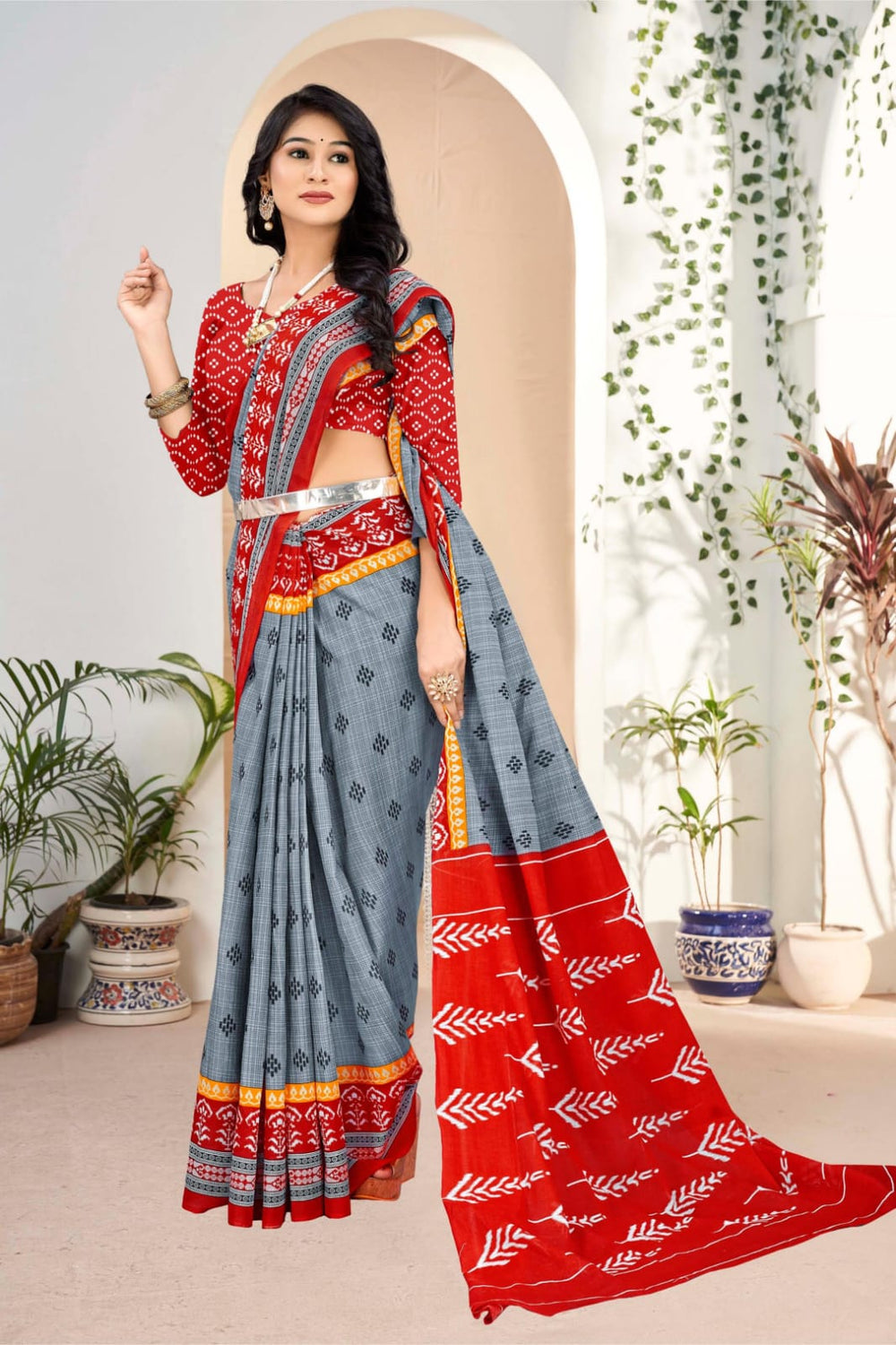 Sophisticated grey and red saree with intricate tribal patterns, crafted from soft handloom cotton.