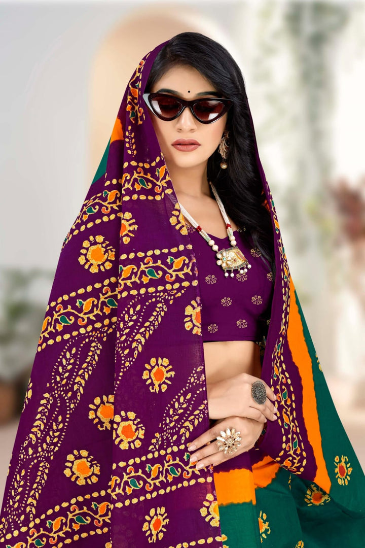 Teal green and purple saree with unique tribal artistry, crafted from soft handloom cotton for ethnic events.