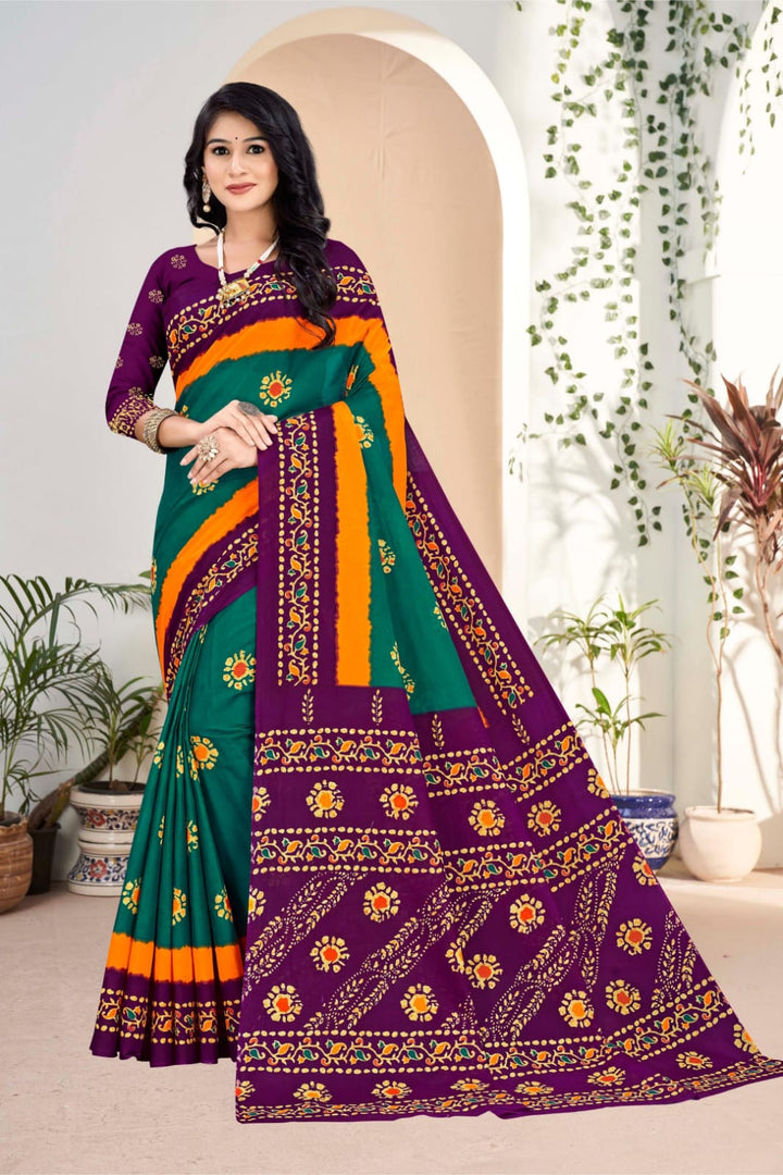 Gorgeous teal green and purple handloom saree with artistic tribal patterns, perfect for festive occasions.