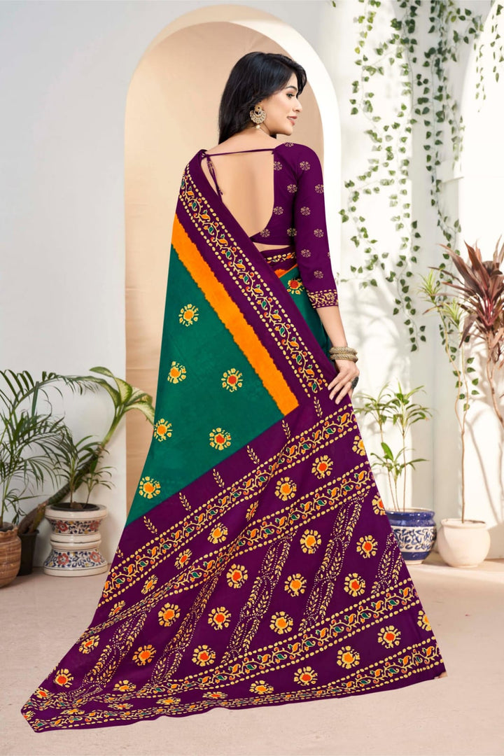 Stunning handloom cotton saree in teal green and purple with beautiful tribal motifs, great for weddings.