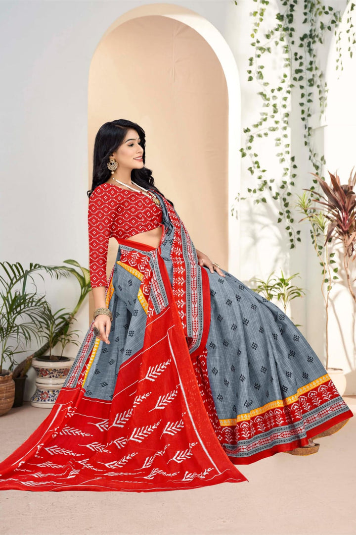 Gorgeous grey and red saree with rich tribal artwork, perfect for cultural celebrations.