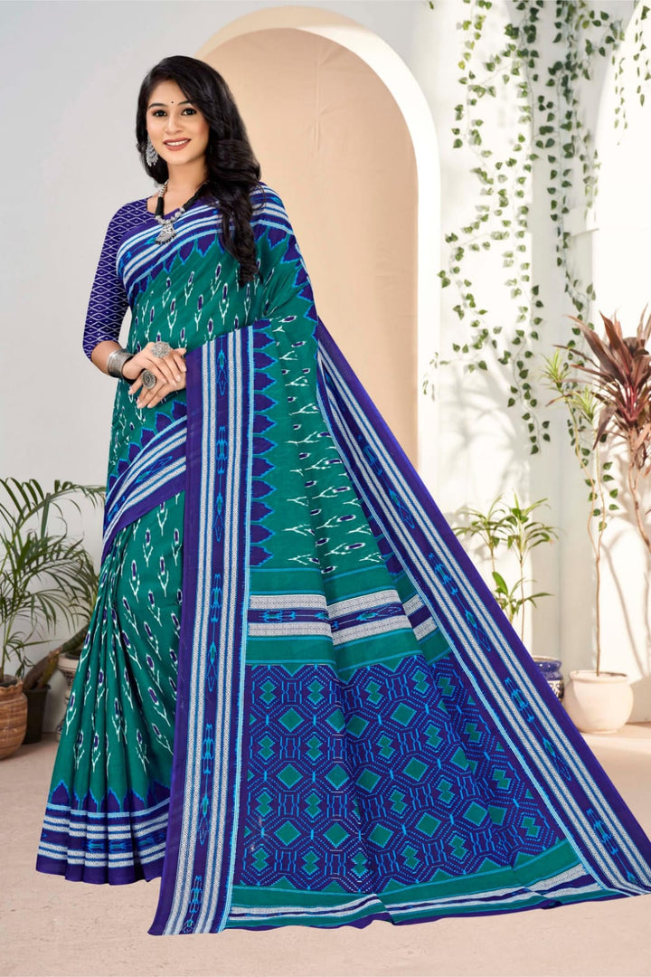 Traditional pine green and blue cotton saree with detailed tribal art, perfect for weddings.