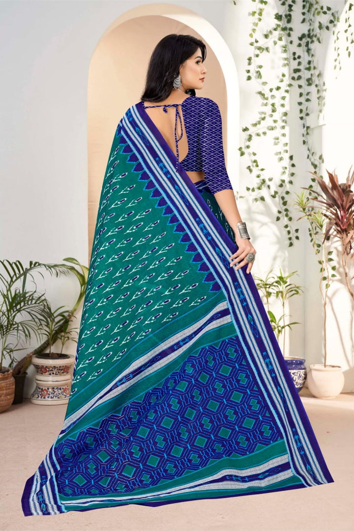 Stylish pine green and blue saree with traditional tribal designs, perfect for cultural occasions.