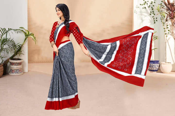 Rich red saree with handloom fabric and tribal designs, perfect for festive gatherings.