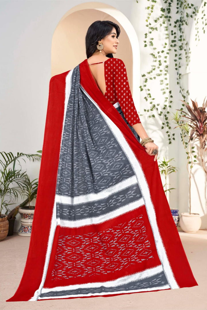 Red handloom saree with unique tribal motifs, perfect for Indian weddings and events.