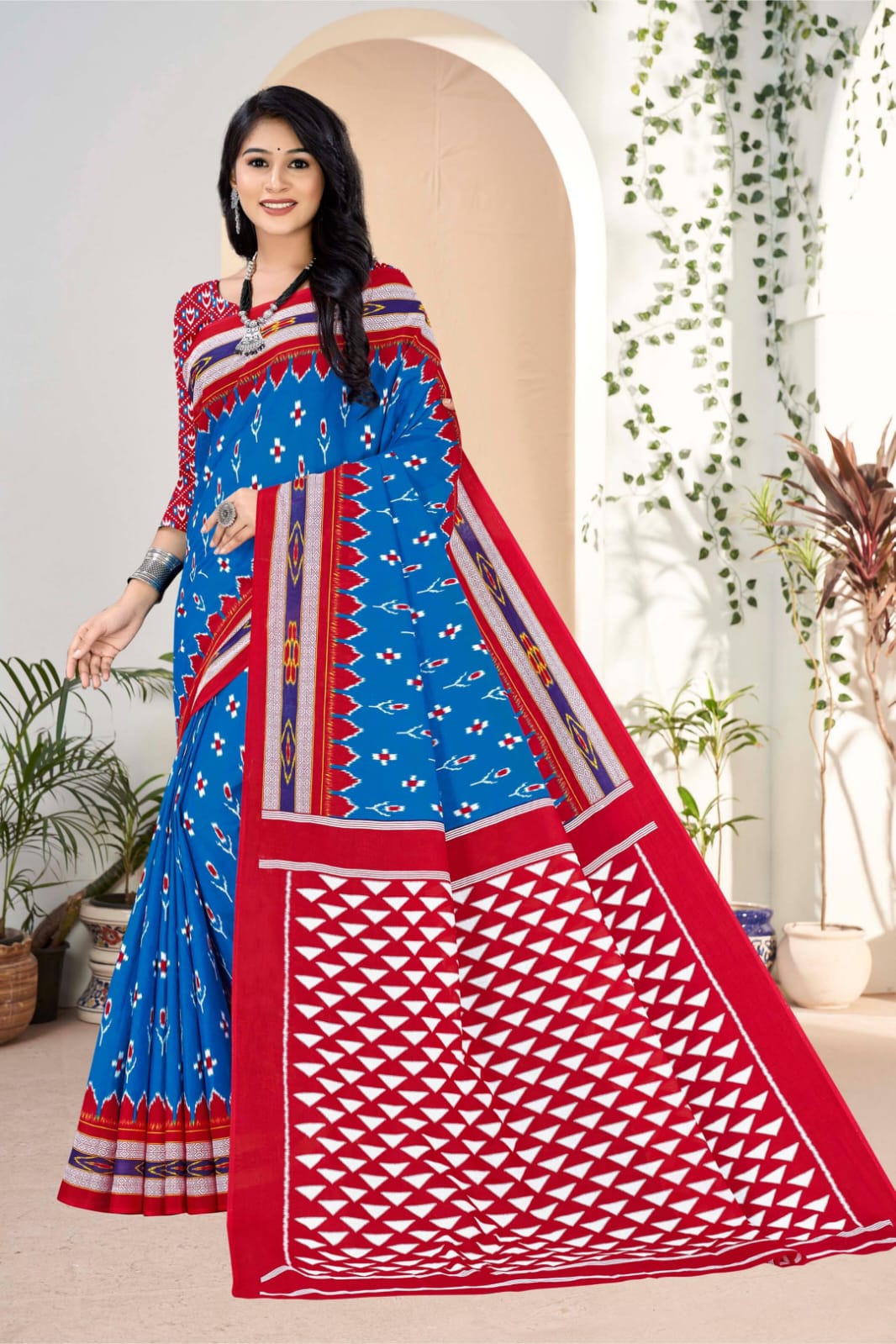 Elegant blue and red Indian saree with unique tribal motifs, perfect for traditional wear.