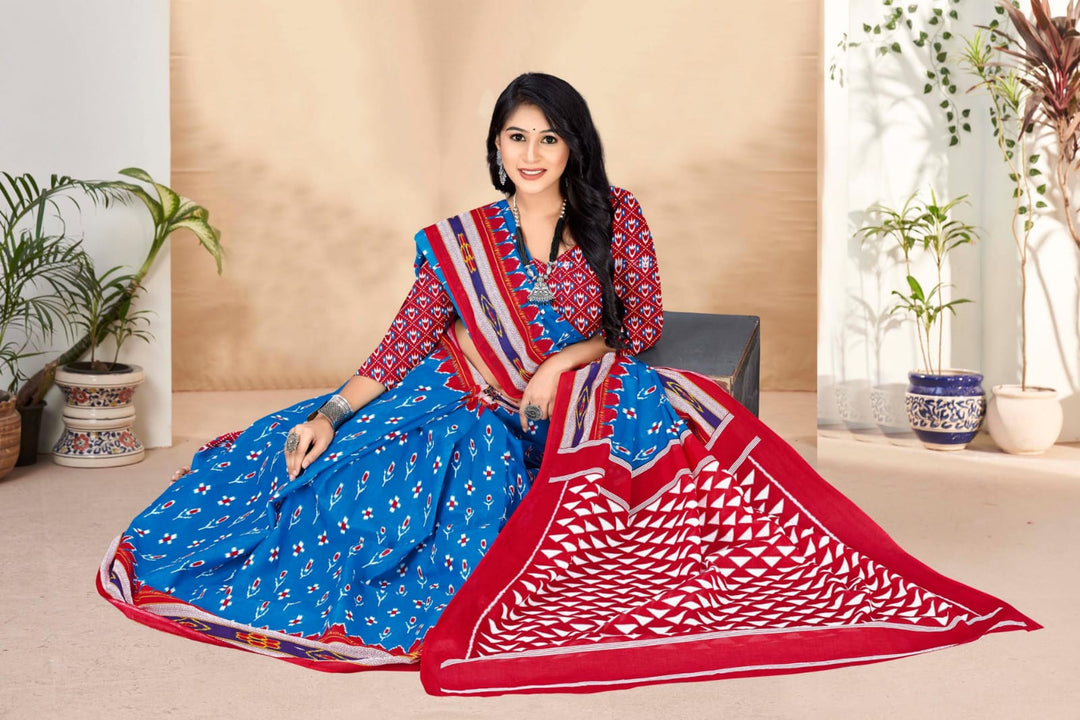 Beautiful blue and red handloom cotton saree featuring tribal patterns, ideal for cultural events.