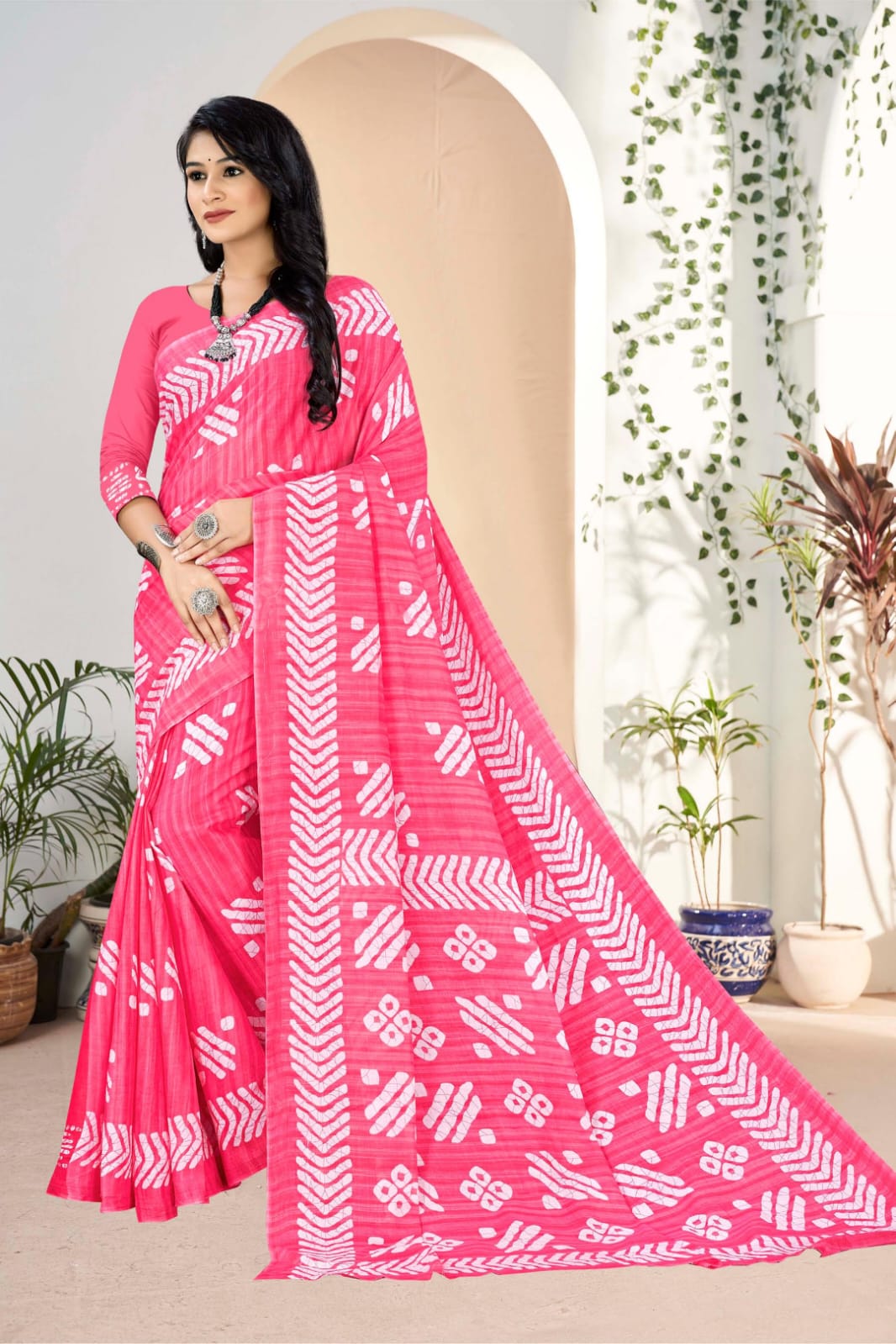 Traditional pink cotton saree with intricate tribal designs, ideal for Indian festivals.