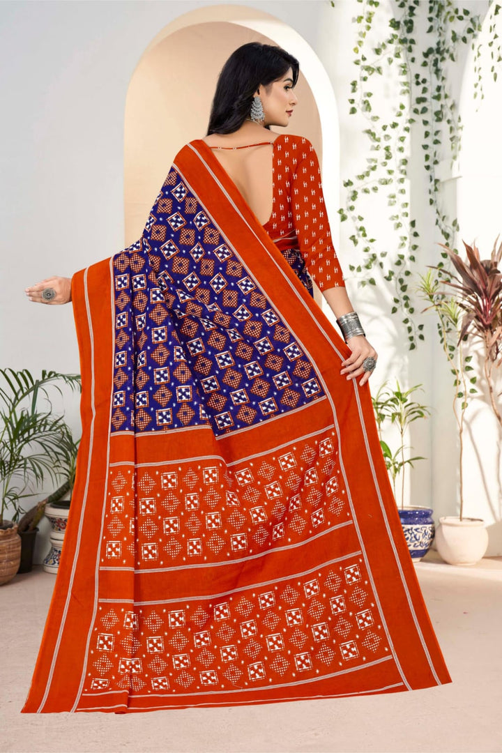 Beautiful handloom cotton saree in midnight blue and orange with tribal detailing, ideal for festive occasions.