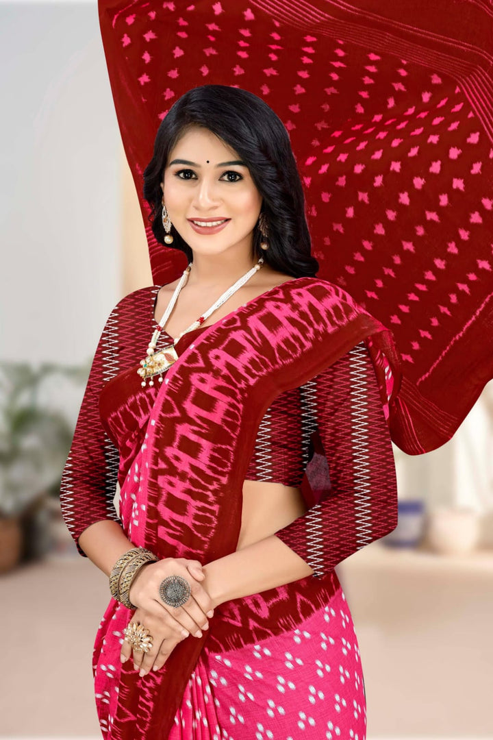 Stylish pink and dark red saree with tribal designs, perfect for festive gatherings.