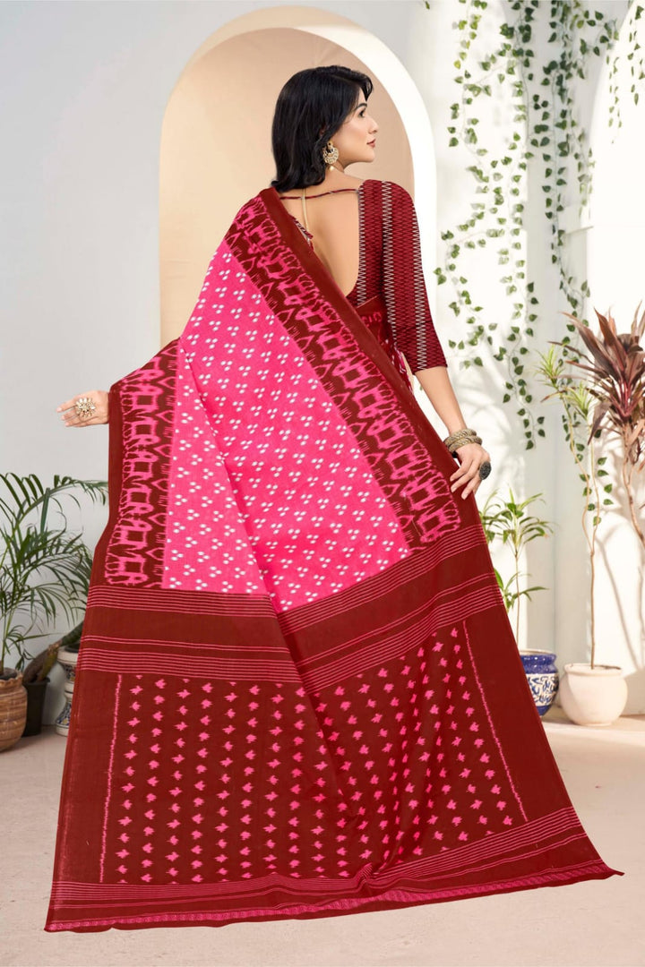 Traditional pink and dark red saree featuring intricate tribal patterns, ideal for Indian weddings.