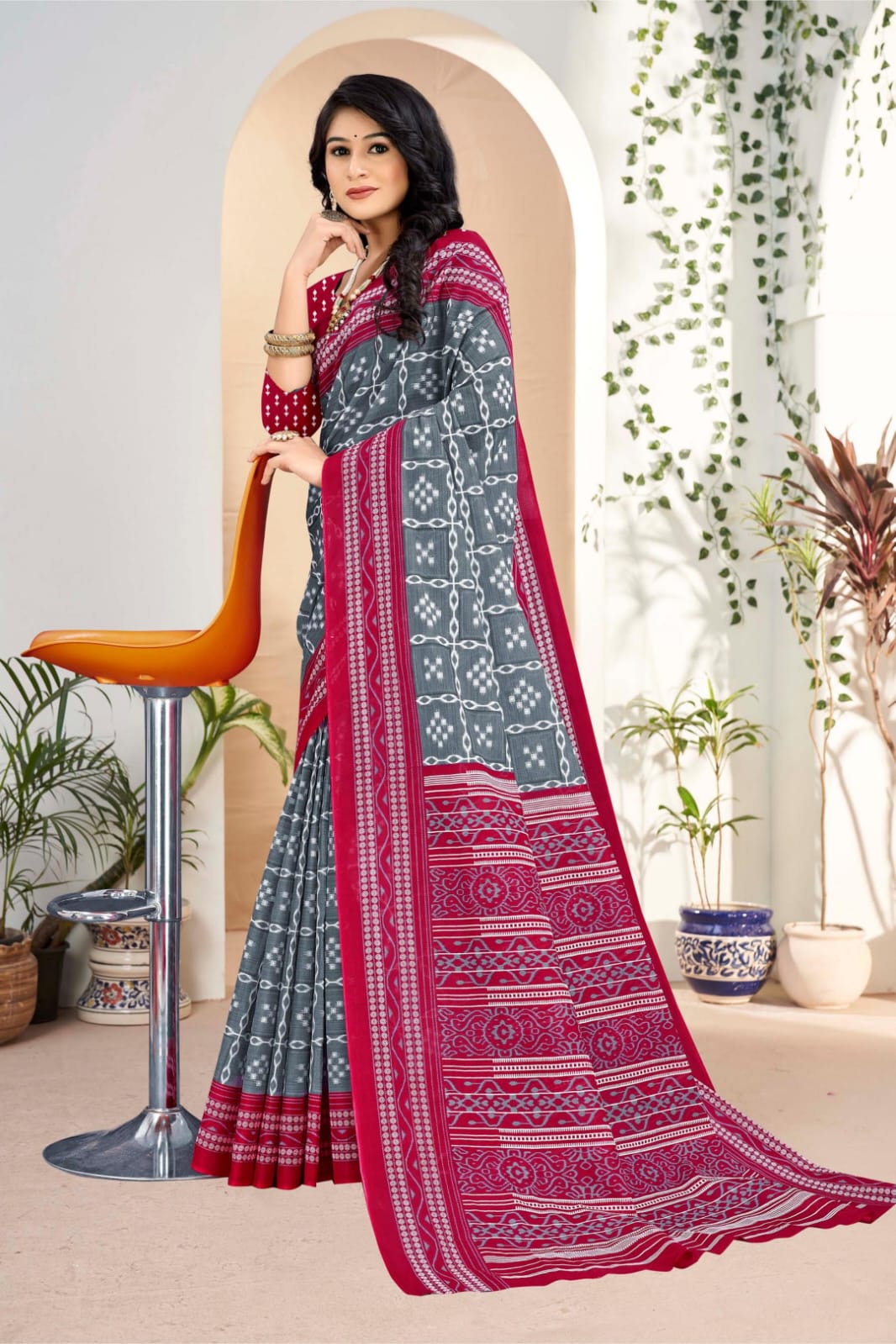 Stylish gray and burgundy Indian saree featuring beautiful tribal art, perfect for weddings and cultural gatherings.