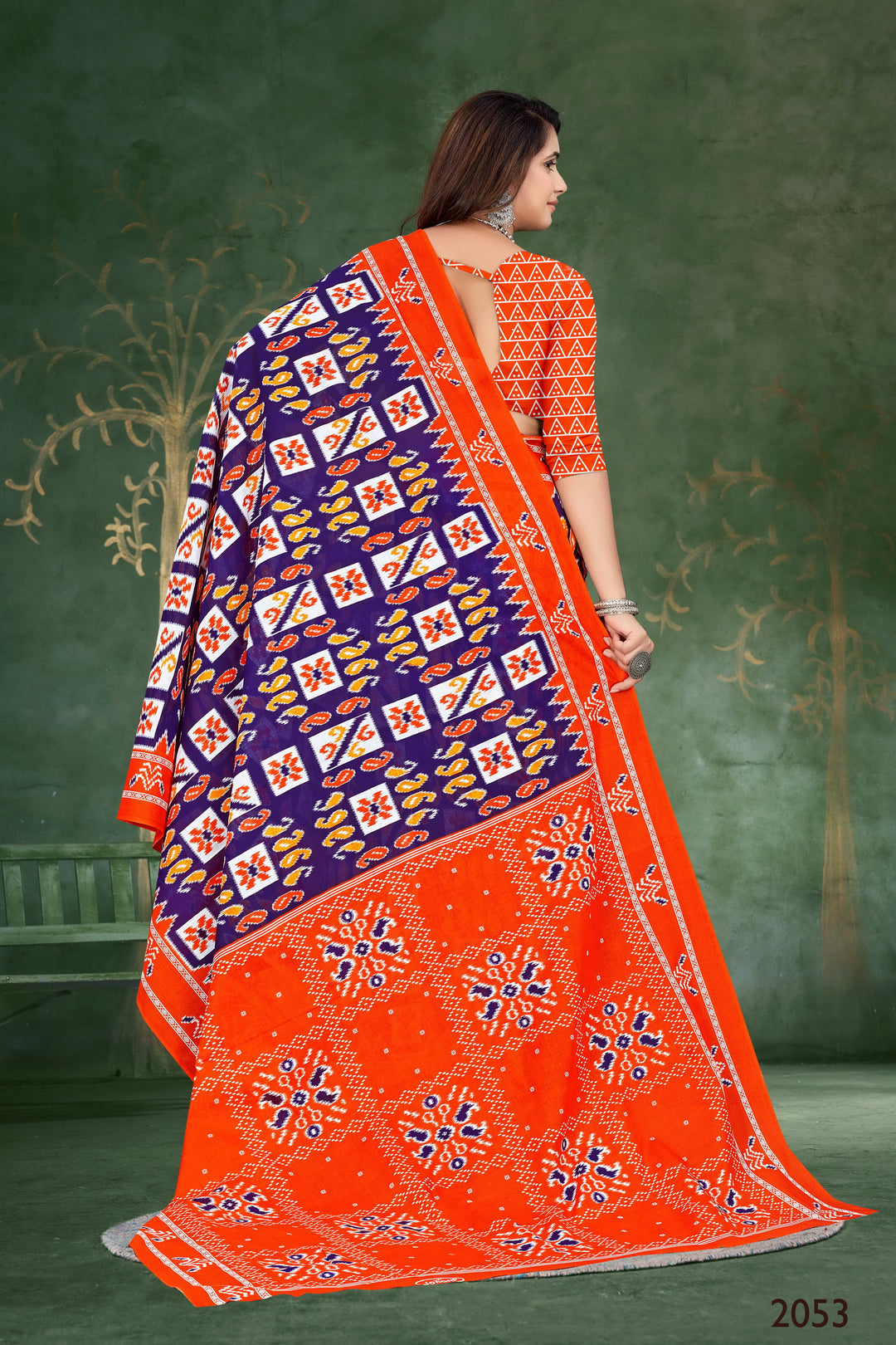 Beautiful orange and blue saree made from handloom cotton with tribal art, perfect for traditional occasions.