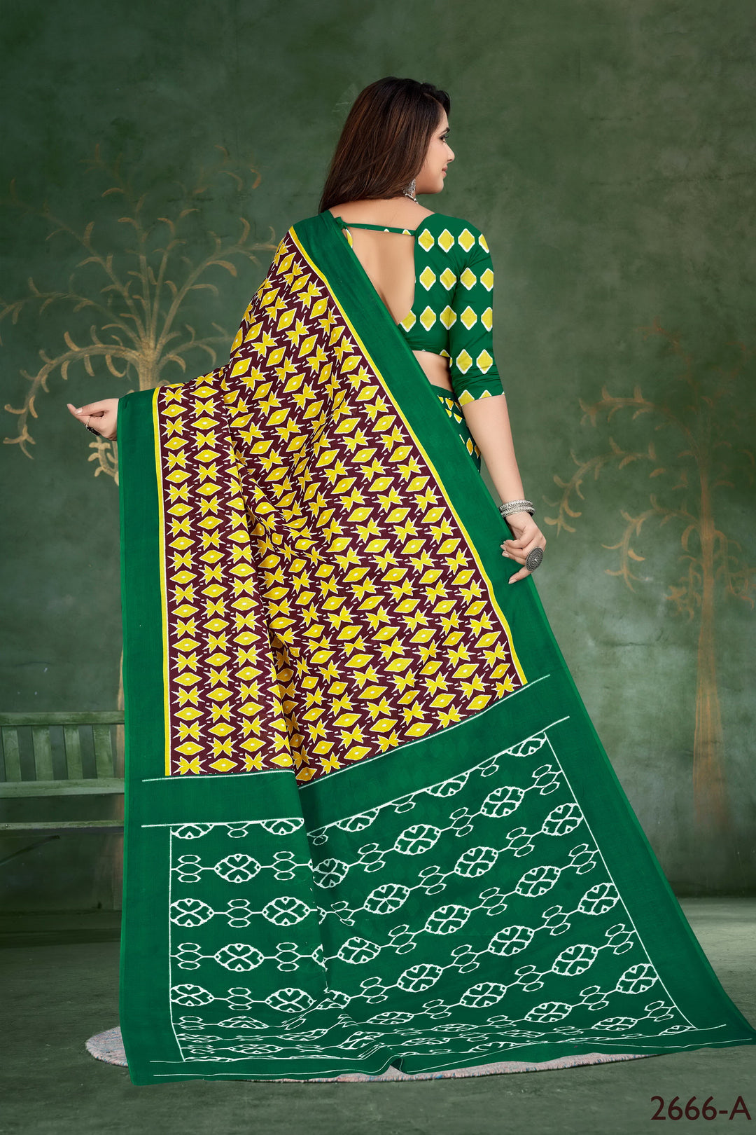 Elegant green handloom cotton saree with tribal motif details, ideal for cultural and festive gatherings.