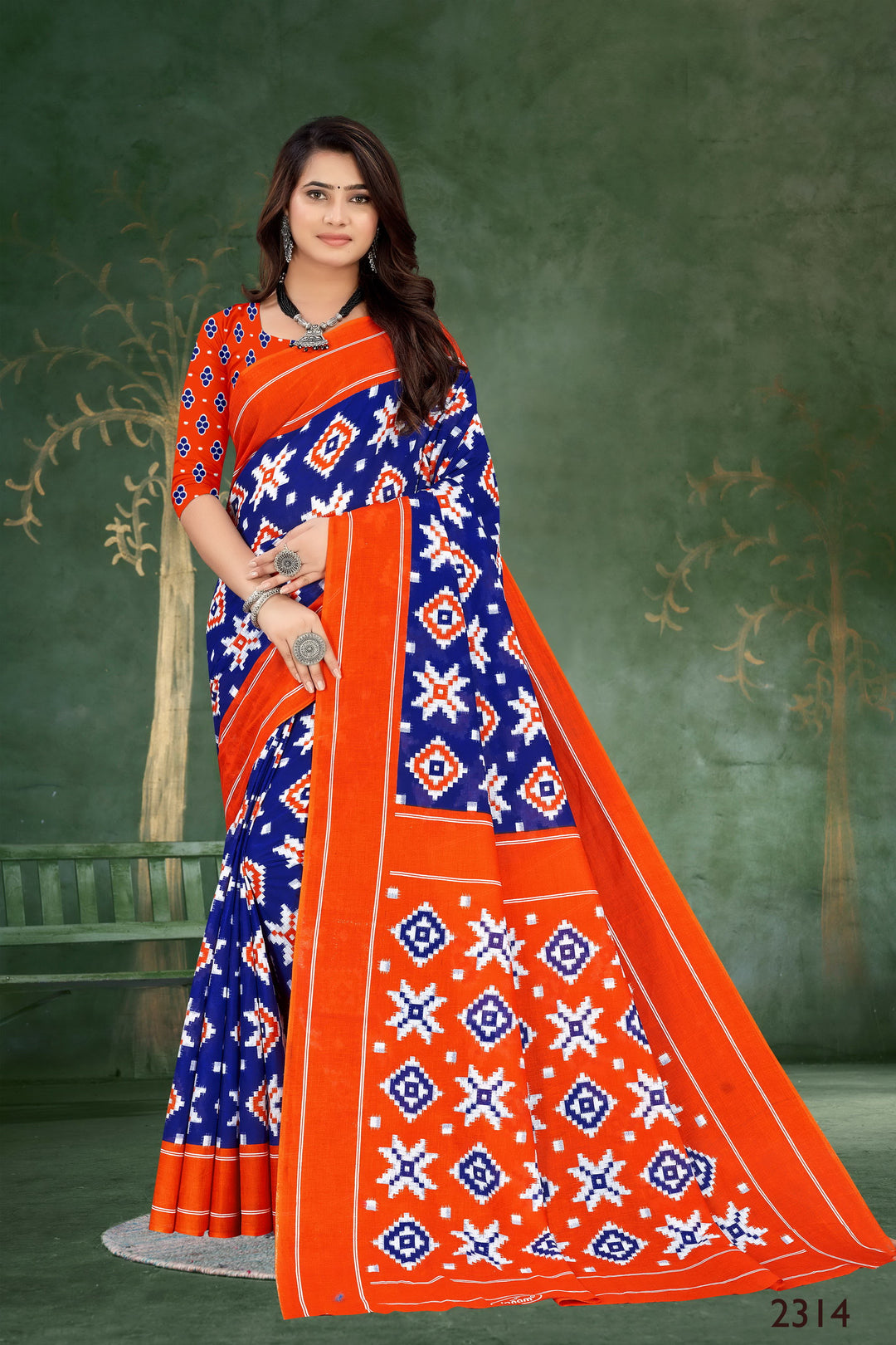 Stunning orange and blue handloom cotton saree with elegant motifs, perfect for Indian weddings.