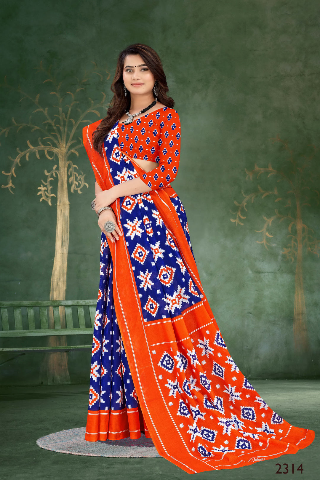 Timeless orange and blue handloom saree with delicate motifs, perfect for cultural and traditional events.