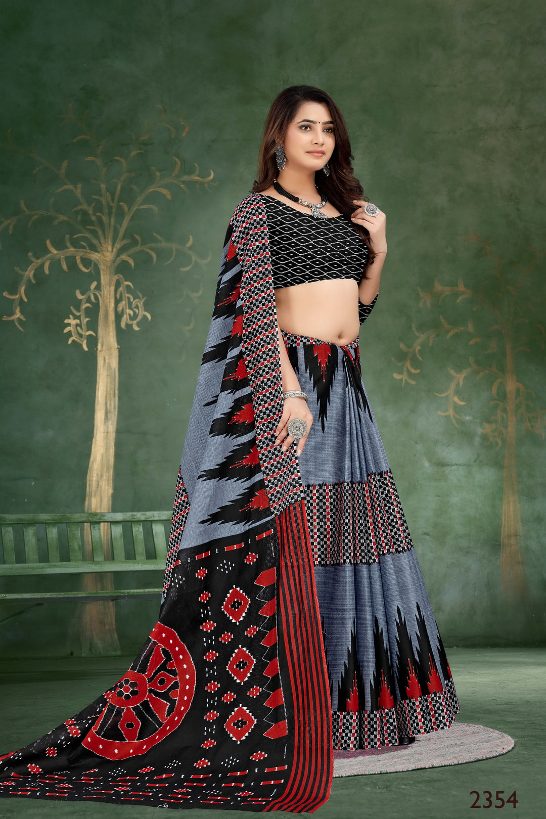 Beautiful grey and black handloom cotton saree with artistic tribal patterns, perfect for ethnic events.