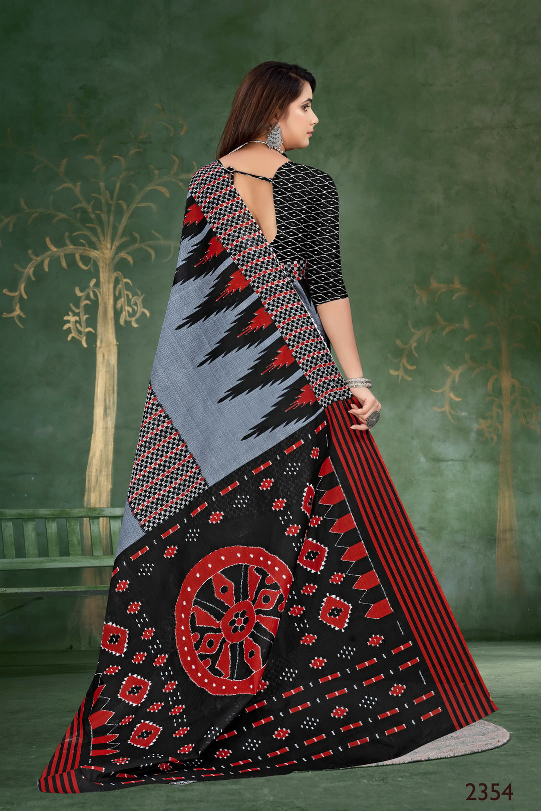 Timeless grey and black handloom saree with detailed tribal artistry, ideal for cultural celebrations.