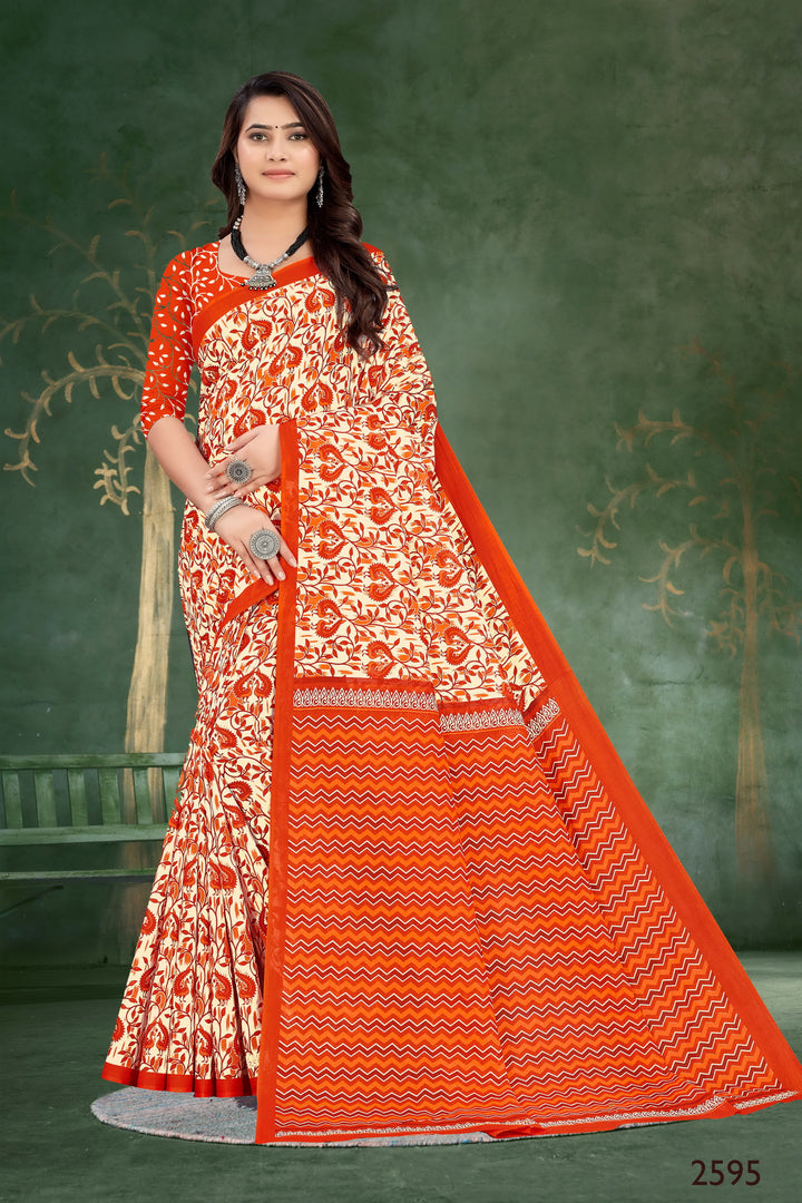 Striking orange handloom cotton saree with intricate patterns, perfect for festive and traditional events.