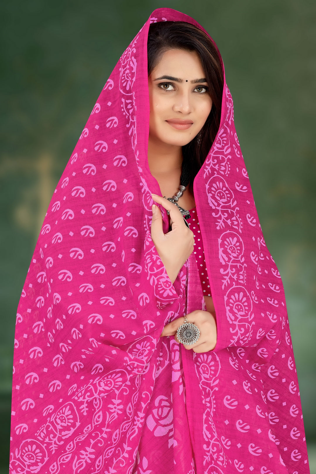 Traditional pink handloom saree with exquisite tribal detailing, ideal for bridal and festive occasions.