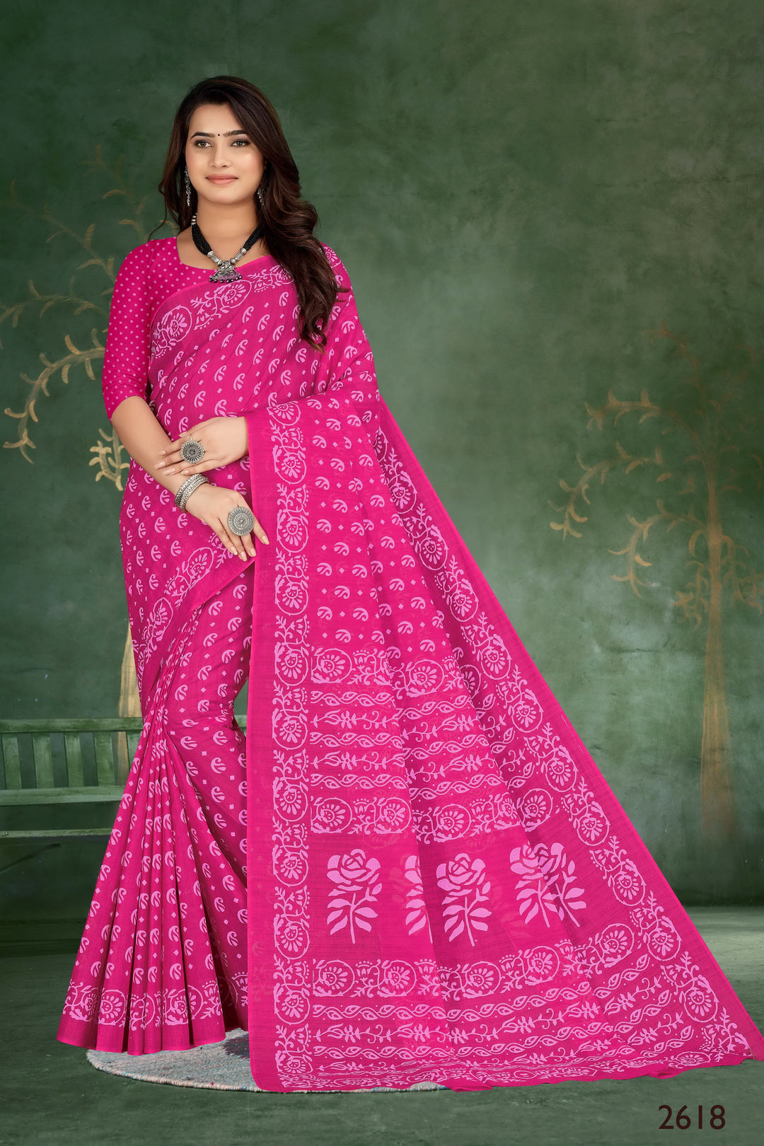 Gorgeous pink handloom cotton saree with tribal motifs, perfect for weddings and festive occasions.