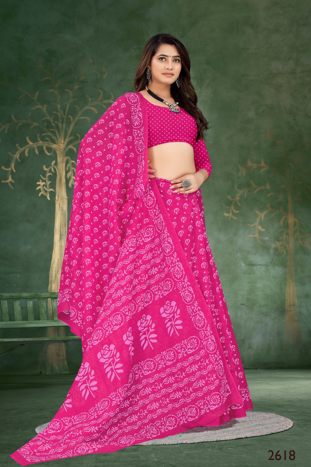 Timeless pink handloom cotton saree with artistic tribal embroidery, perfect for cultural events.