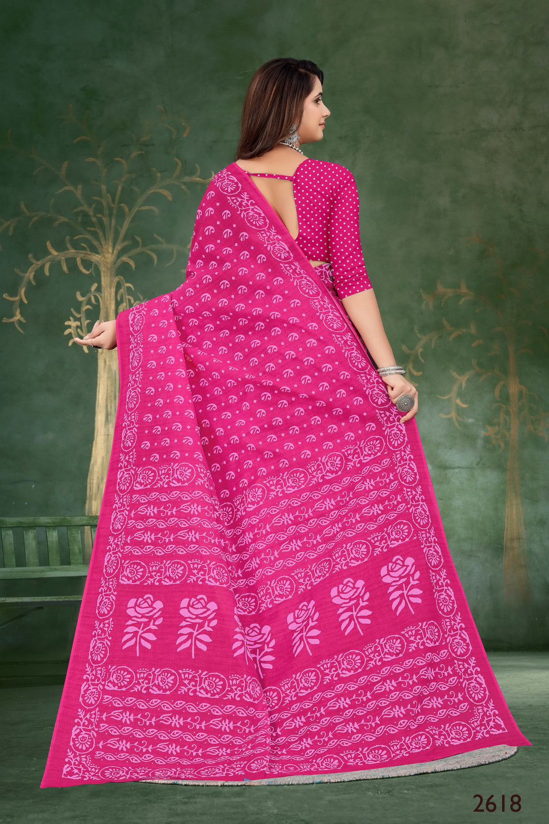 Elegant pink saree made from soft handloom cotton, adorned with stunning tribal motifs for a unique look.