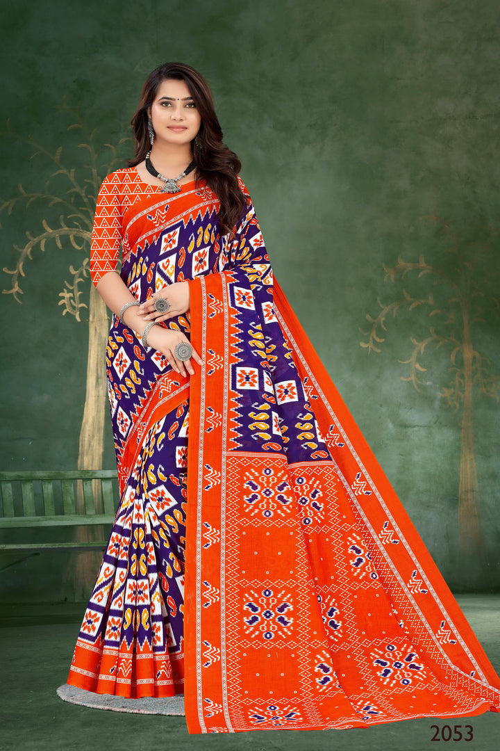 Vibrant orange and blue handloom cotton saree with intricate tribal artistry, perfect for festive and cultural events.