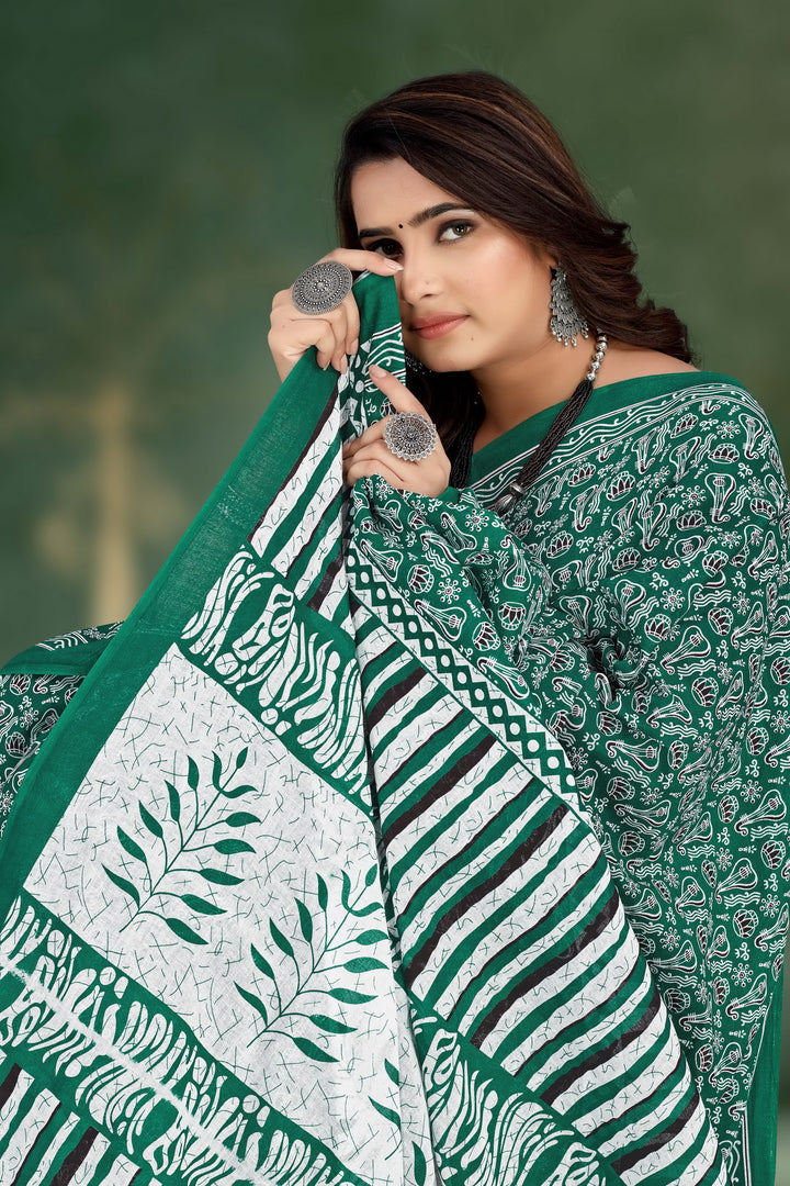 Elegant green handloom saree with beautiful tribal motifs, ideal for festive celebrations and cultural events.