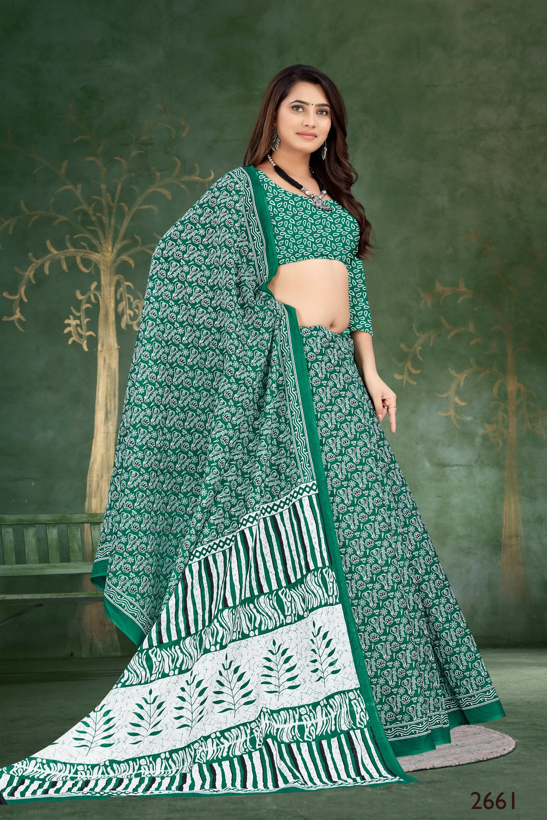 Elegant green Indian saree with intricate tribal motif designs, ideal for cultural and festive events.