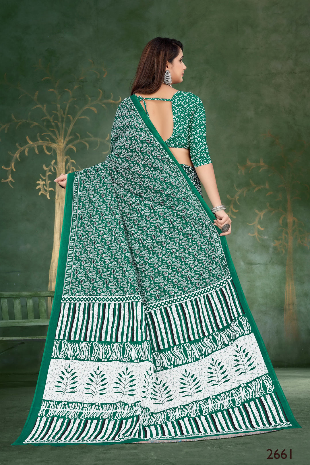 Gorgeous green handloom cotton saree featuring tribal details, perfect for weddings and special occasions.