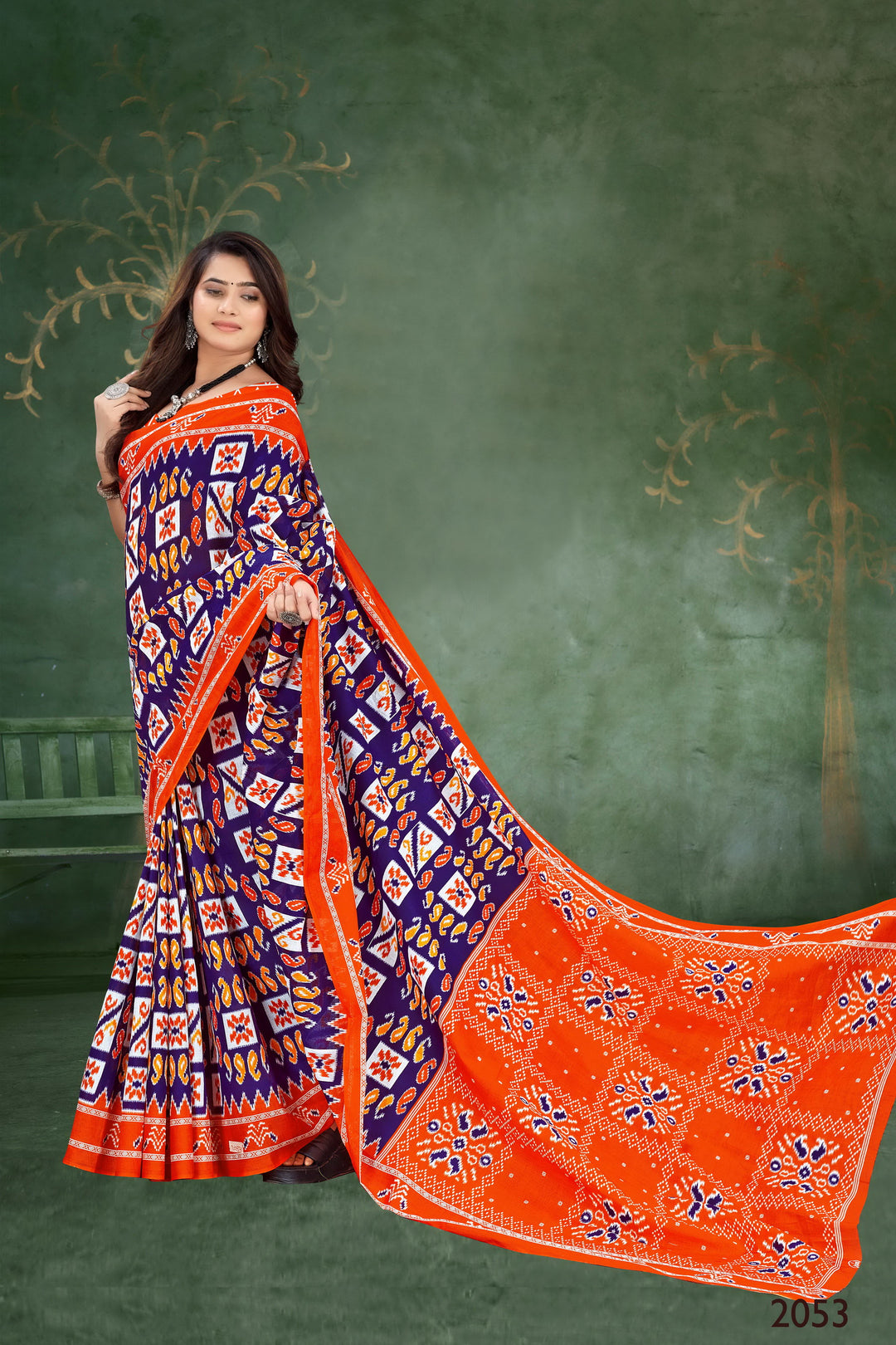 Elegant handloom cotton saree in vibrant orange and blue with exquisite tribal artistry, perfect for festive wear.