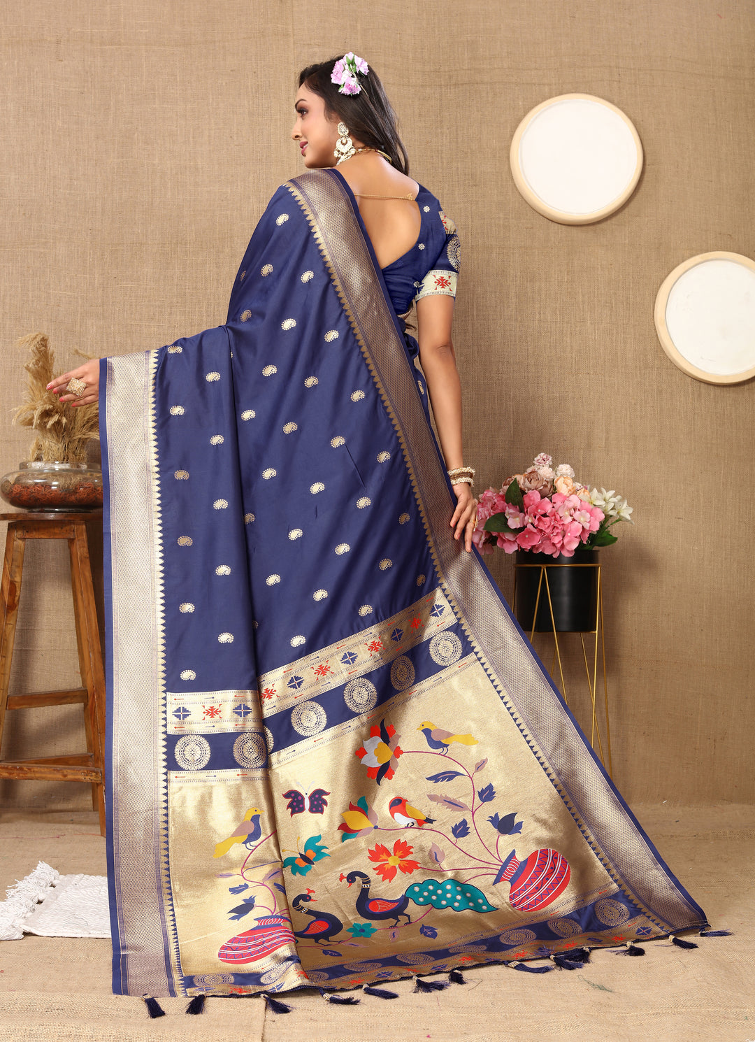 Sophisticated navy Paithani silk saree with intricate zari work, perfect for grand celebrations.