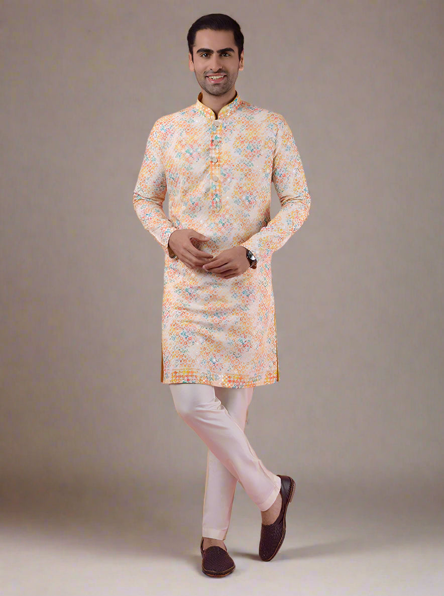 This embroidered Yellow and Orange Kurta Pajama promises comfort and elegance, designed for modern celebrations.