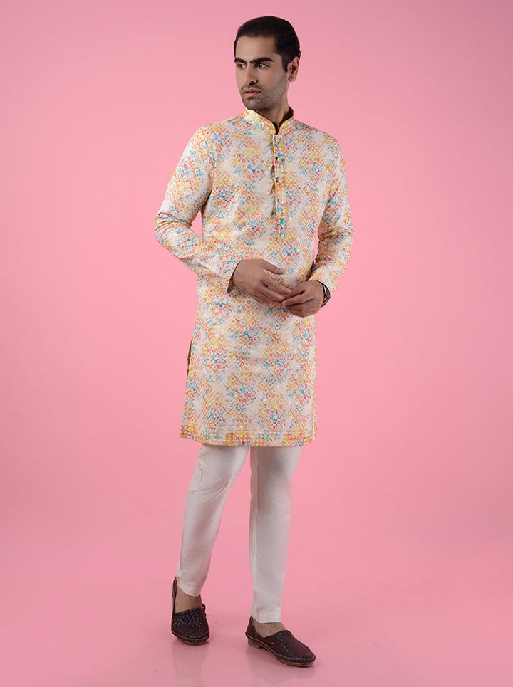 Experience the charm of this Yellow and Orange Silk Blend Kurta Pajama, perfect for making a statement at any event.