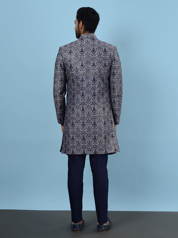 Be the center of attention at your sangeet or reception in the USA with this Grey & Blue Indowestern, designed with premium silk blend and intricate embroidery for a stylish flair.