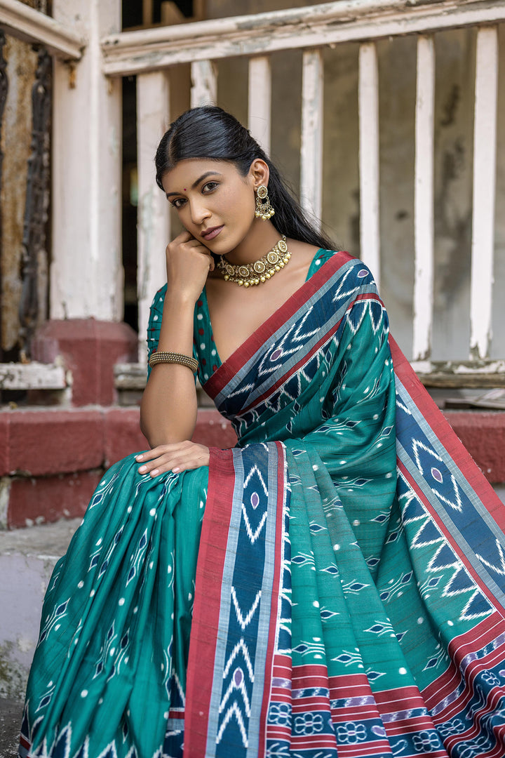 Soft Tussar saree featuring a temple border, Ikkat pattern, and contrast blouse