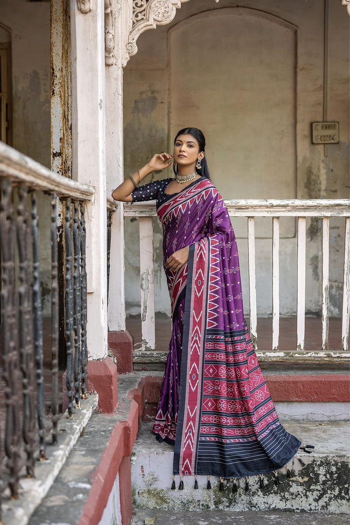 Elegant Ikkat print Tussar saree with temple border, perfect for festivals and family gatherings