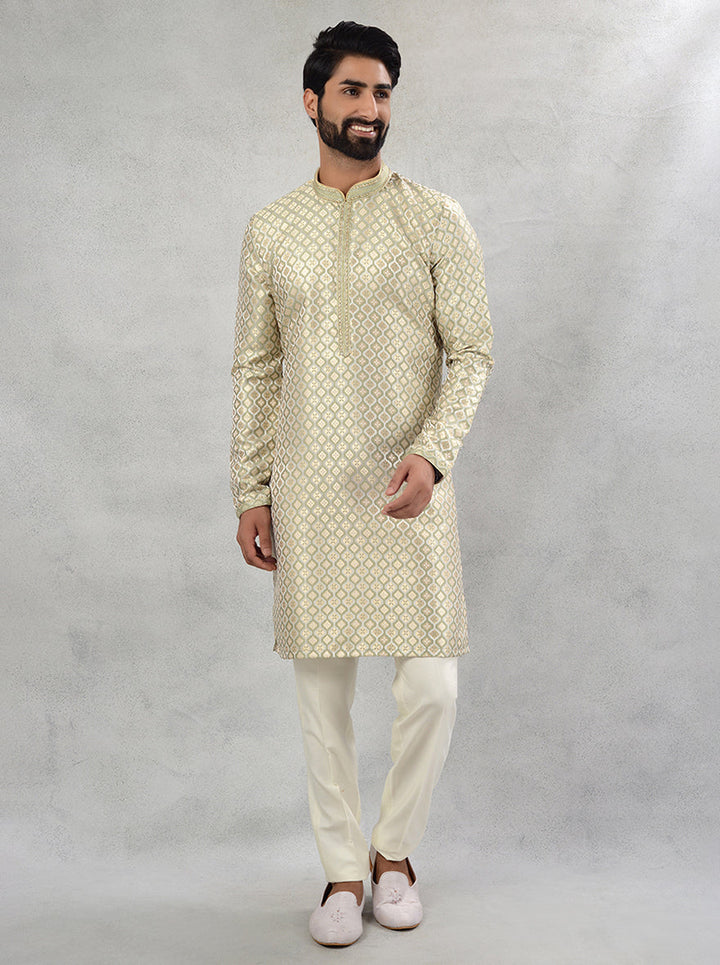 Elevate your festive attire with this stylish cream green silk jacquard kurta pajama, crafted for sophistication.