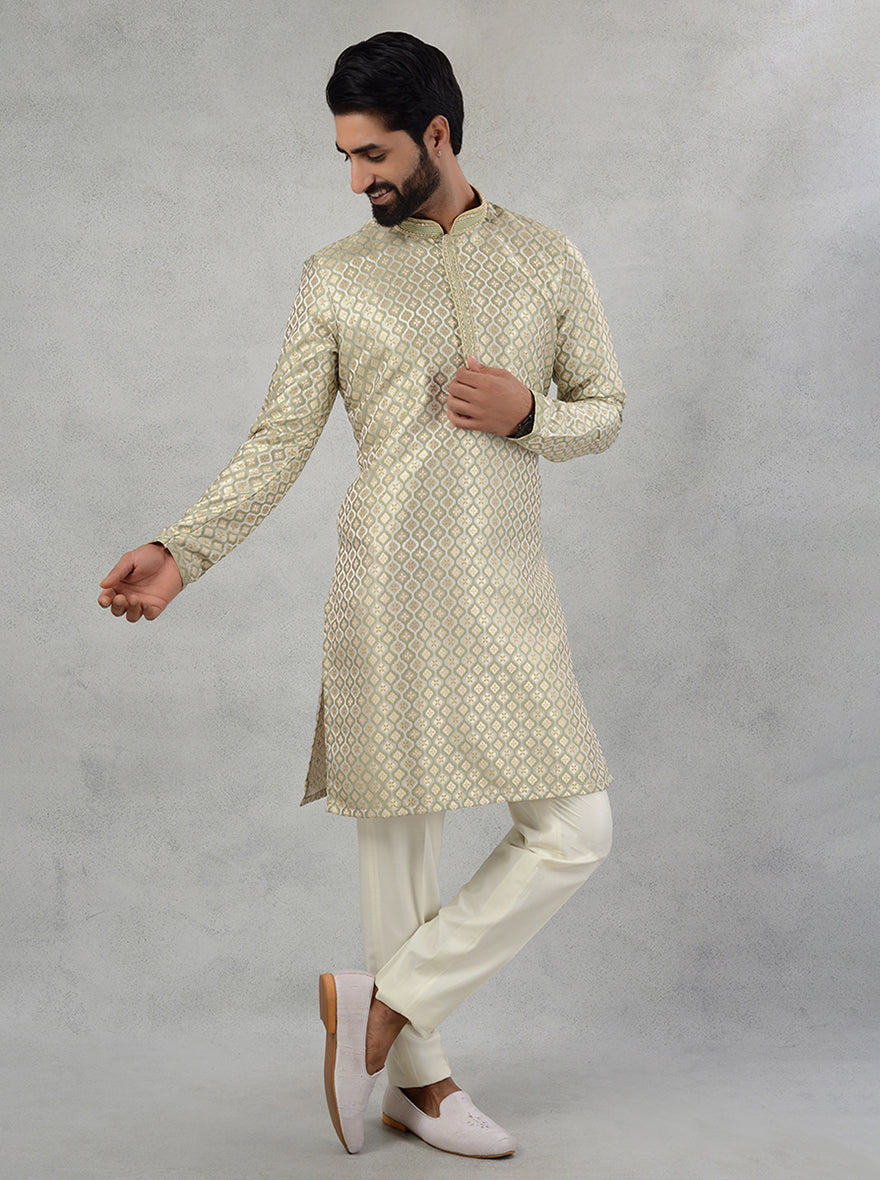 Discover the blend of luxury and comfort with this cream green silk jacquard kurta pajama for modern celebrations.