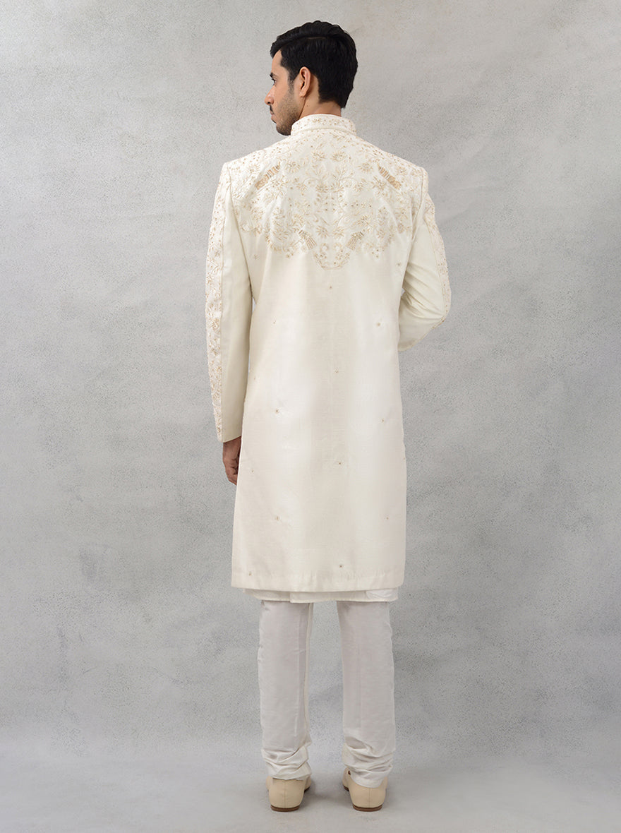 Celebrate love in style with this off-white silk blend sherwani, designed for those who appreciate luxury and elegance at their wedding events.